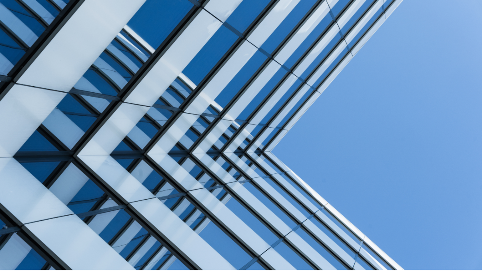 Glass skyscraper and blue sky Glass skyscraper and blue sky