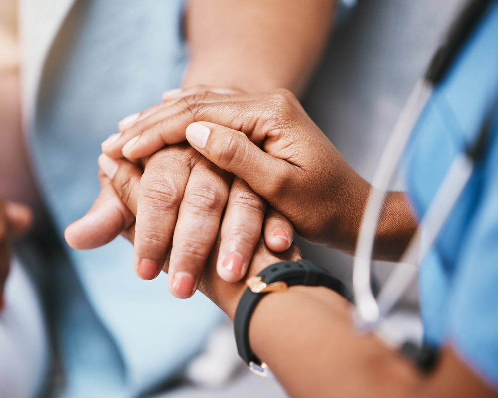 healthcare practician holding patients hand healthcare practician holding patients hand